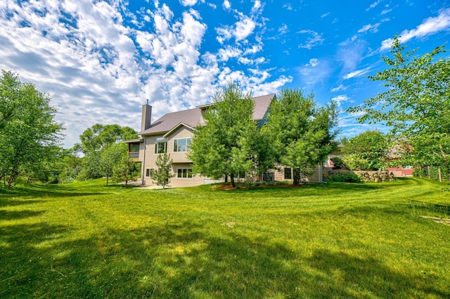 1167 56th St, Hudson, WI 54016 - view of green lawn featuring a patio