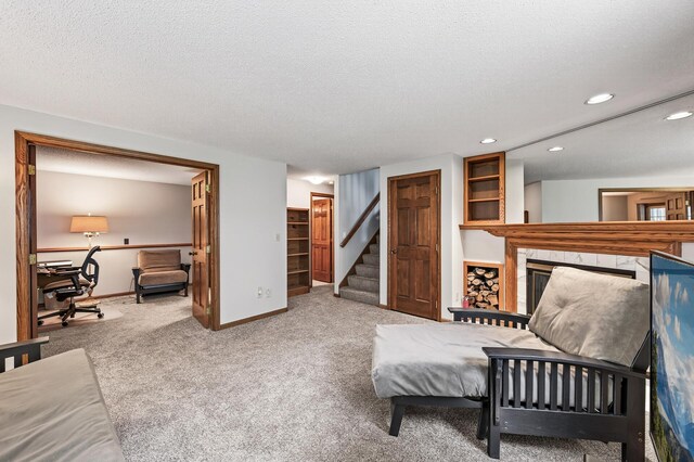 5711 Donegal Dr, Shoreview, MN 55126 - living area with stairway, carpet floors, a fireplace, recessed lighting, and a textured ceiling