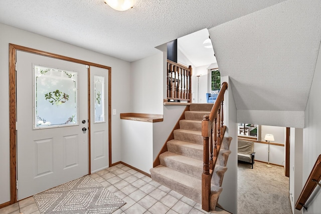 5711 Donegal Dr, Shoreview, MN 55126 - entrance foyer with a textured ceiling, stairway, and light tile patterned flooring
