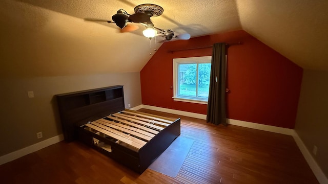 707 11th Ave SE, Rochester, MN 55904 - bonus room featuring wood finished floors, a textured ceiling, vaulted ceiling, a ceiling fan, and baseboards