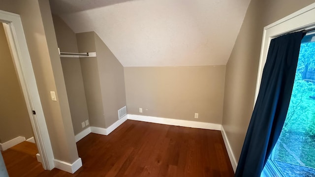 707 11th Ave SE, Rochester, MN 55904 - bonus room with wood finished floors, lofted ceiling, and baseboards