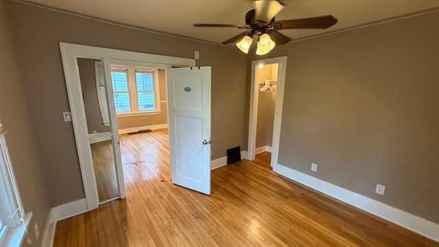 707 11th Ave SE, Rochester, MN 55904 - empty room featuring light wood-type flooring, baseboards, and ceiling fan