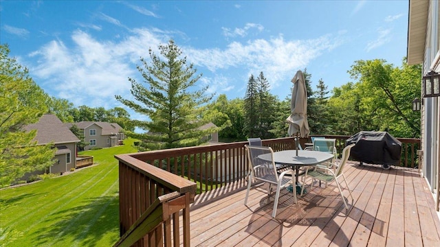 4132 Omaha Ln NW, Alexandria, MN 56308 - deck with grilling area, outdoor dining space, and a lawn