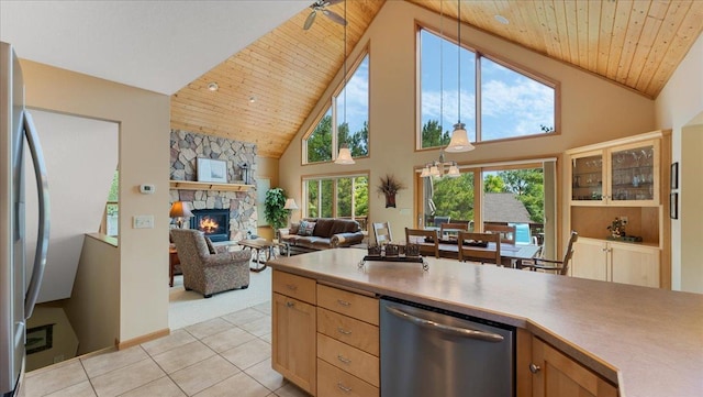 4132 Omaha Ln NW, Alexandria, MN 56308 - kitchen featuring appliances with stainless steel finishes, wooden ceiling, high vaulted ceiling, a fireplace, and light tile patterned flooring