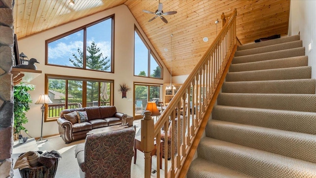 4132 Omaha Ln NW, Alexandria, MN 56308 - carpeted living area featuring wood ceiling, stairway, high vaulted ceiling, and a ceiling fan