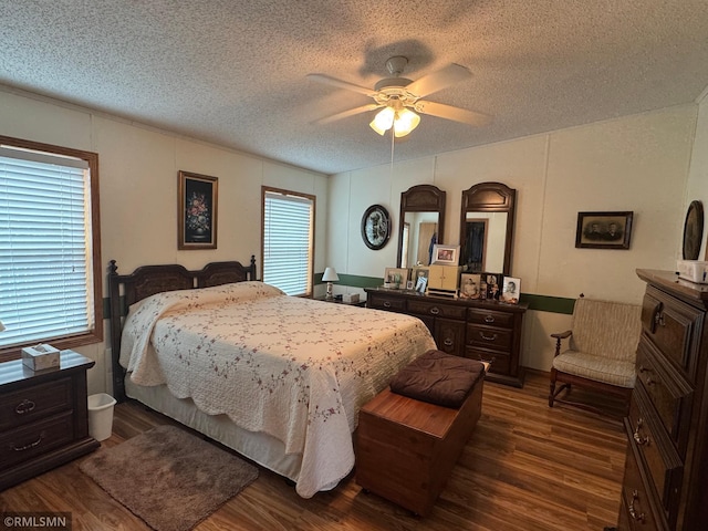 18755 Cassie Ln, Pokegama Twp, MN 55063 - bedroom with dark wood-style flooring, a textured ceiling, and a ceiling fan