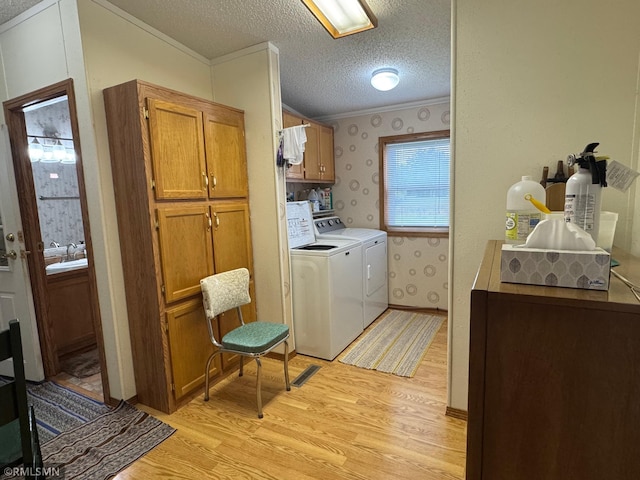 18755 Cassie Ln, Pokegama Twp, MN 55063 - washroom with crown molding, cabinet space, light wood-style floors, washer and clothes dryer, and wallpapered walls