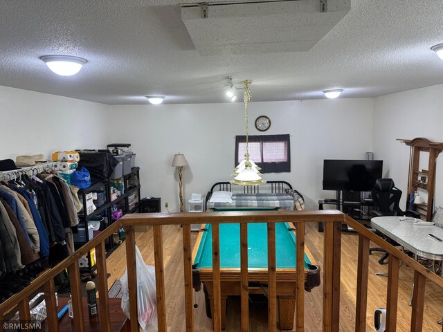 18755 Cassie Ln, Pokegama Twp, MN 55063 - miscellaneous room featuring a textured ceiling and wood finished floors