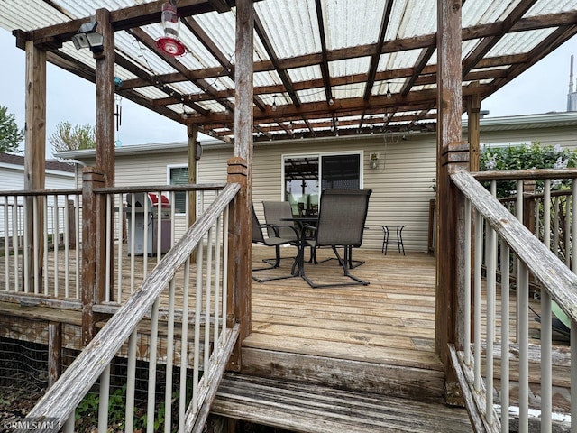 18755 Cassie Ln, Pokegama Twp, MN 55063 - wooden terrace with outdoor dining area