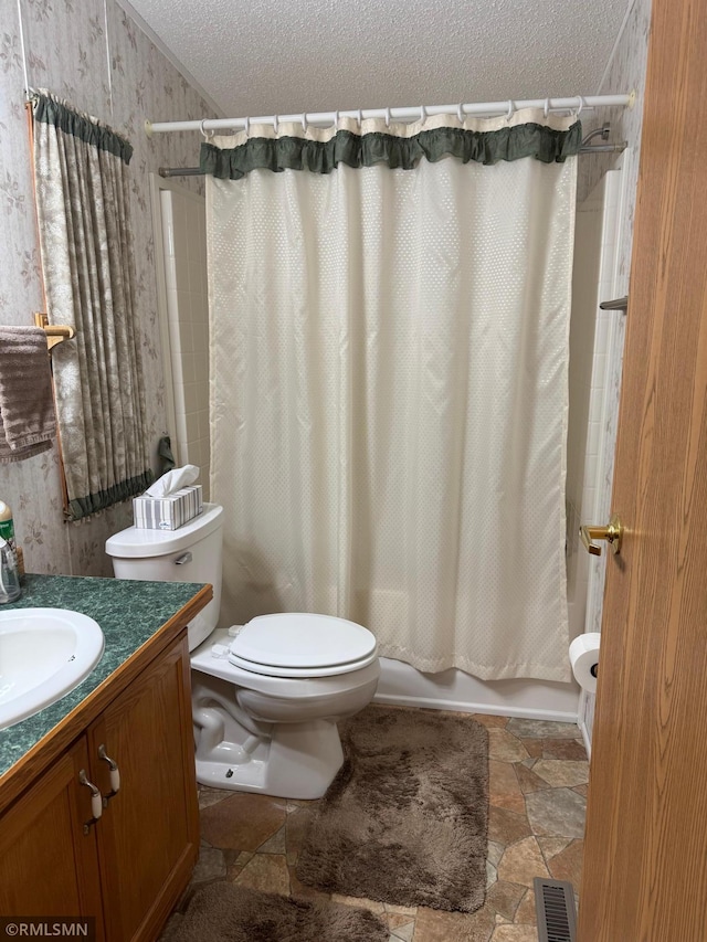 18755 Cassie Ln, Pokegama Twp, MN 55063 - bathroom featuring a textured ceiling, stone finish floors, toilet, vanity, and shower / bath combo