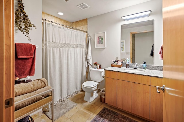 748 3rd St N Unit 504, Minneapolis, MN 55401 - bathroom with toilet, vanity, curtained shower, and tile patterned flooring