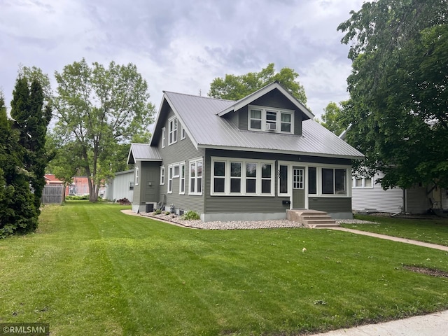 305 7th Ave E, Alexandria, MN 56308 - bungalow-style house featuring a front lawn, metal roof, and central air condition unit