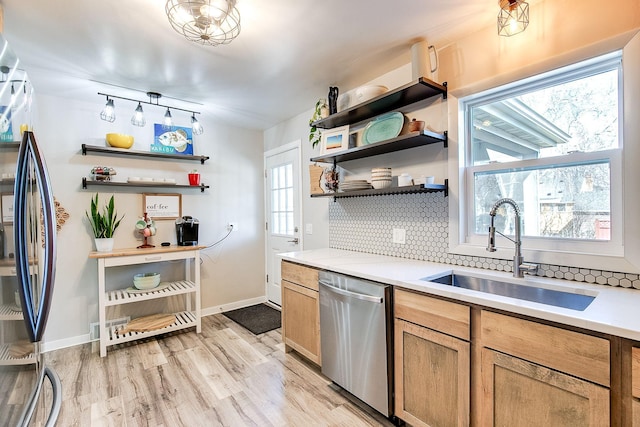 321 15th Ave N, Hopkins, MN 55343 - kitchen with appliances with stainless steel finishes, open shelves, decorative backsplash, and light countertops