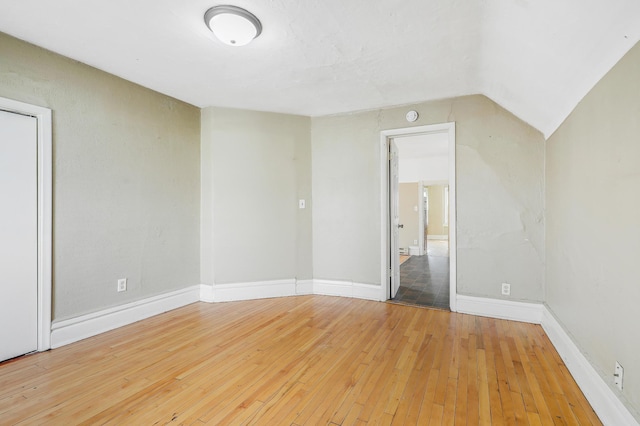 420 Lafond Ave, Saint Paul, MN 55103 - unfurnished bedroom with hardwood / wood-style floors, baseboards, and vaulted ceiling
