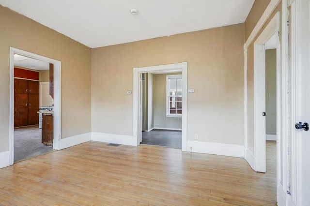 420 Lafond Ave, Saint Paul, MN 55103 - spare room featuring light wood-type flooring, baseboards, and a smoke detector