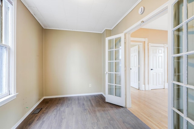 420 Lafond Ave, Saint Paul, MN 55103 - unfurnished room featuring french doors, wood finished floors, baseboards, crown molding, and a smoke detector