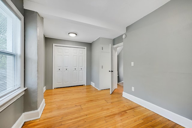 420 Lafond Ave, Saint Paul, MN 55103 - unfurnished bedroom featuring light wood-style flooring, baseboards, and a closet