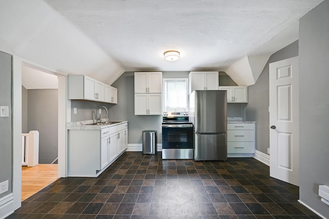 420 Lafond Ave, Saint Paul, MN 55103 - kitchen featuring stainless steel appliances, lofted ceiling, white cabinets, baseboards, and a sink