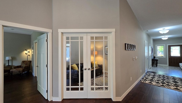1300 Event Center Dr NE # 23, Bemidji, MN 56601 - corridor featuring french doors, hardwood / wood-style flooring, baseboards, and high vaulted ceiling