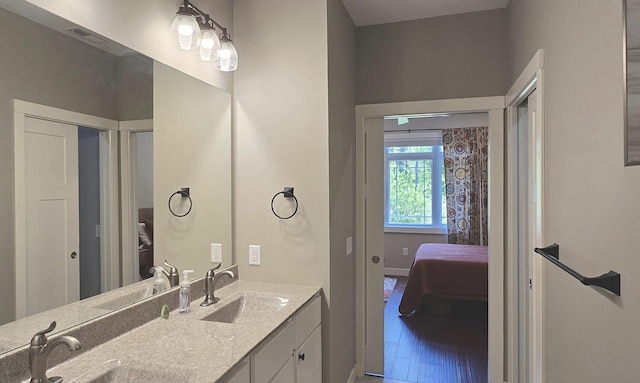 1300 Event Center Dr NE # 23, Bemidji, MN 56601 - bathroom with ensuite bathroom, double vanity, and baseboards