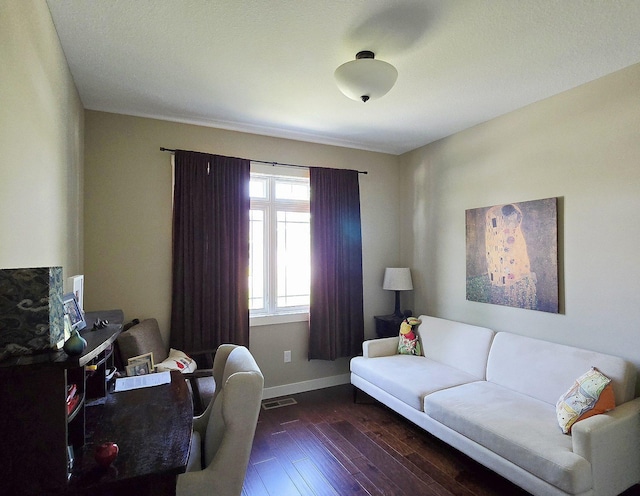 1300 Event Center Dr NE # 23, Bemidji, MN 56601 - living room with baseboards and hardwood / wood-style floors