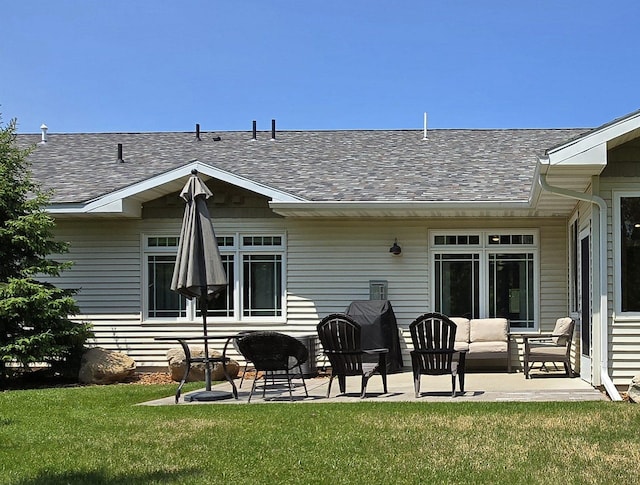 1300 Event Center Dr NE # 23, Bemidji, MN 56601 - rear view of property featuring roof with shingles and a patio area