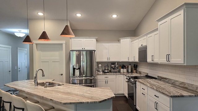 1300 Event Center Dr NE # 23, Bemidji, MN 56601 - kitchen with appliances with stainless steel finishes, a sink, tasteful backsplash, a breakfast bar, and recessed lighting