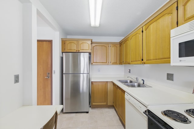 1425 28th St Unit 201, Minneapolis, MN 55408 - kitchen with white appliances, a sink, light countertops, and light tile patterned flooring