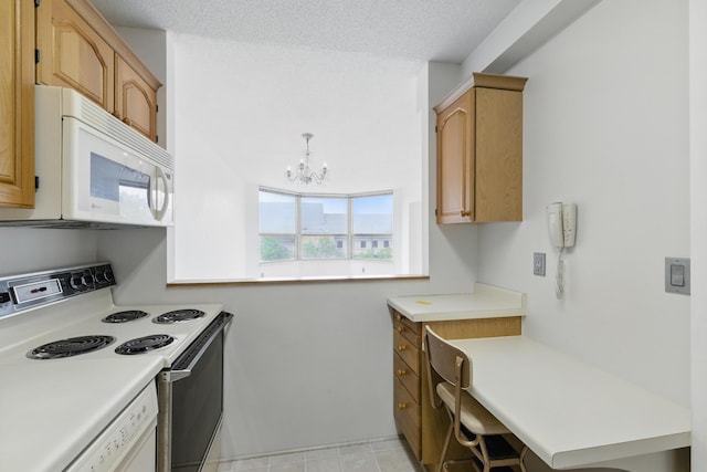 1425 28th St Unit 201, Minneapolis, MN 55408 - kitchen featuring white appliances, light countertops, and a chandelier