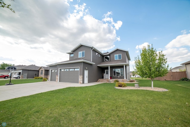 1520 36th Ave S, Moorhead, MN 56560 - traditional home with driveway, stone siding, an attached garage, and covered porch