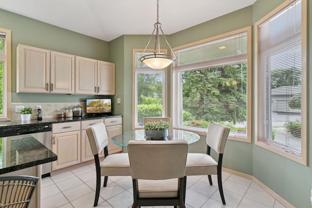8910 Hilloway Rd, Eden Prairie, MN 55347 - dining area with healthy amount of natural light and light tile patterned floors