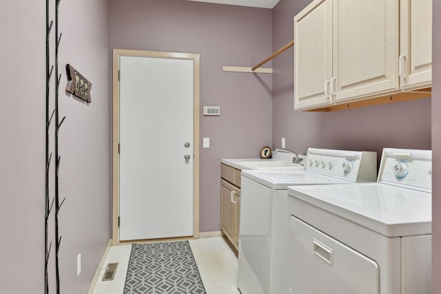 8910 Hilloway Rd, Eden Prairie, MN 55347 - laundry area featuring washer and dryer and cabinet space