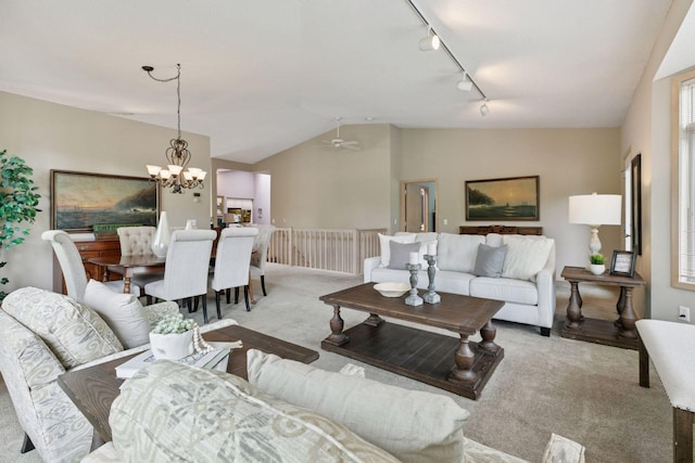 8910 Hilloway Rd, Eden Prairie, MN 55347 - living area featuring carpet, rail lighting, lofted ceiling, a chandelier, and a ceiling fan