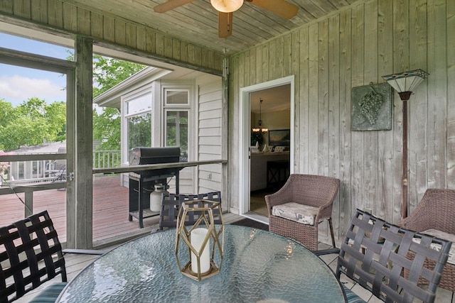 8910 Hilloway Rd, Eden Prairie, MN 55347 - sunroom featuring outdoor dining space and ceiling fan