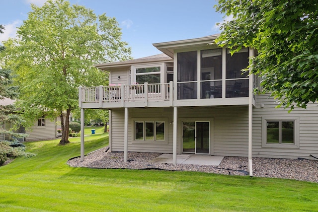 8910 Hilloway Rd, Eden Prairie, MN 55347 - rear view of property with a lawn, a patio area, and a sunroom