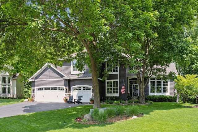 6253 Niagara Ct N, Maple Grove, MN 55311 - view of front of property with asphalt driveway, a front yard, and an attached garage