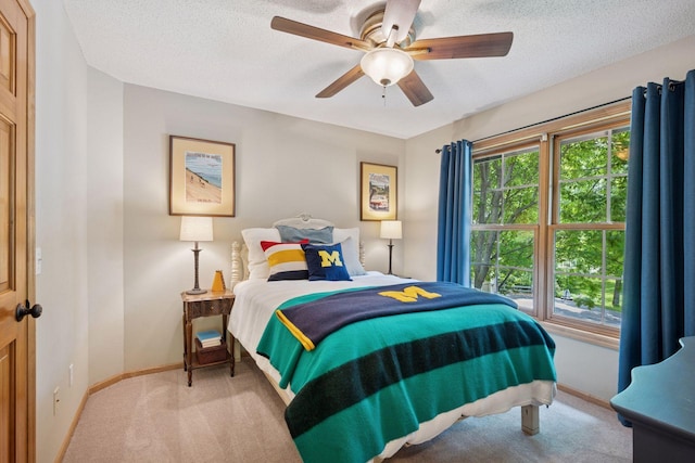 6253 Niagara Ct N, Maple Grove, MN 55311 - carpeted bedroom with baseboards, a textured ceiling, and a ceiling fan