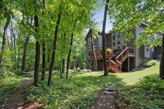 6253 Niagara Ct N, Maple Grove, MN 55311 - rear view of property featuring stairs, a wooden deck, and a lawn