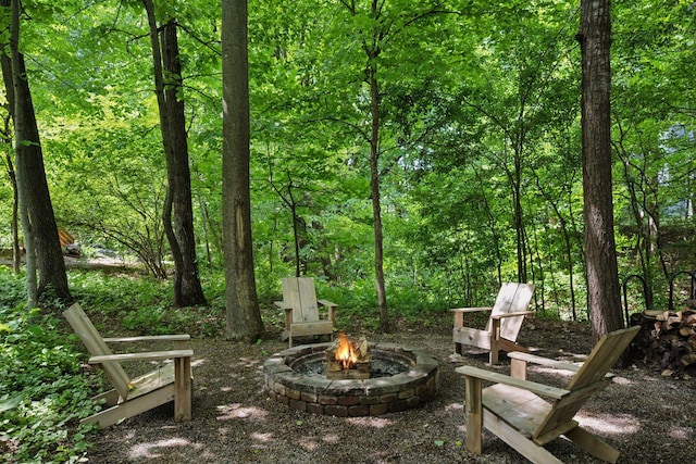6253 Niagara Ct N, Maple Grove, MN 55311 - view of patio / terrace featuring a fire pit and a wooded view