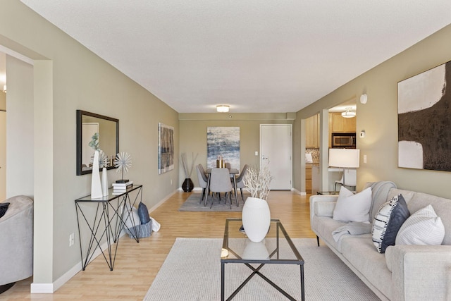52 Groveland Ter Unit A402, Minneapolis, MN 55403 - living room with light wood-type flooring and baseboards