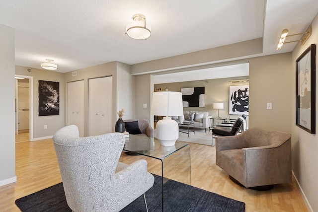 52 Groveland Ter Unit A402, Minneapolis, MN 55403 - living room with light wood finished floors and baseboards