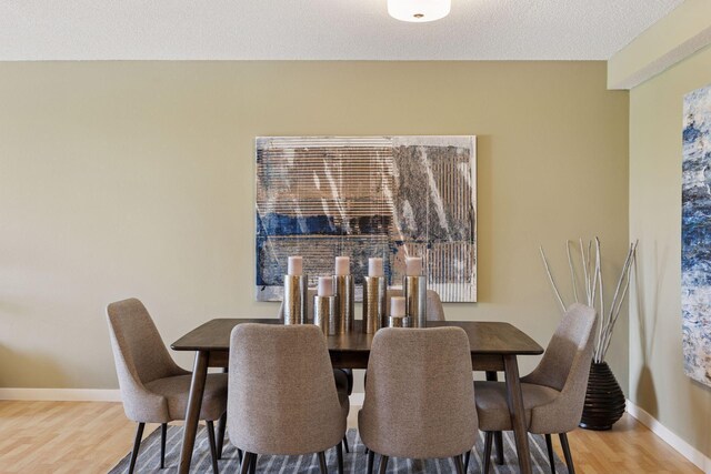 52 Groveland Ter Unit A402, Minneapolis, MN 55403 - dining room featuring wood finished floors and baseboards