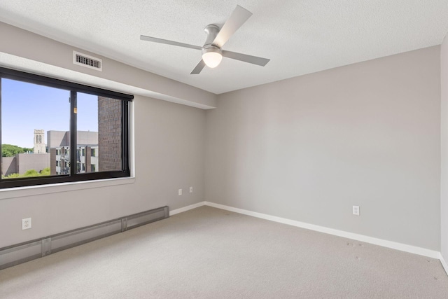 52 Groveland Ter Unit A402, Minneapolis, MN 55403 - carpeted spare room with a baseboard radiator, ceiling fan, baseboards, and a textured ceiling