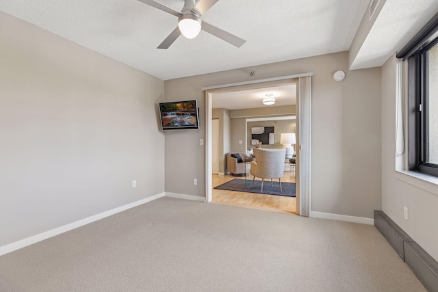 52 Groveland Ter Unit A402, Minneapolis, MN 55403 - unfurnished room with carpet, a ceiling fan, and baseboards
