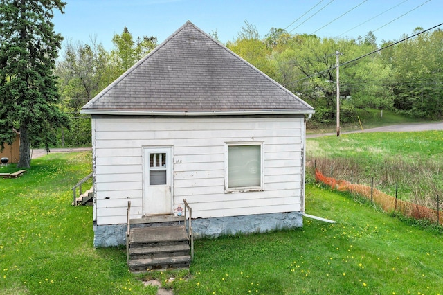 168 Central Entrance, Duluth, MN 55811 - back of property with a yard, entry steps, and roof with shingles