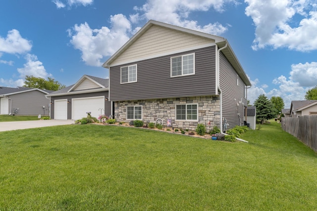 641 Beverly St, Wanamingo, MN 55983 - view of front of property with a garage, stone siding, and driveway