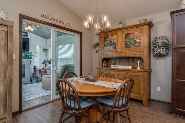 641 Beverly St, Wanamingo, MN 55983 - dining space featuring lofted ceiling, a chandelier, and wood finished floors