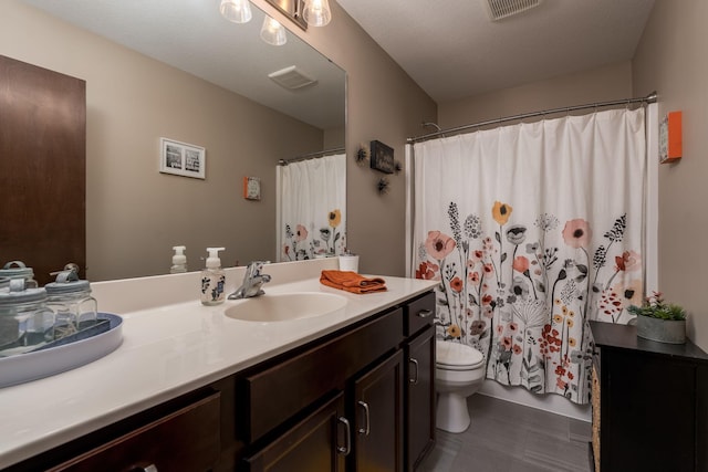 641 Beverly St, Wanamingo, MN 55983 - full bathroom featuring vanity, toilet, tile patterned flooring, and a shower with shower curtain