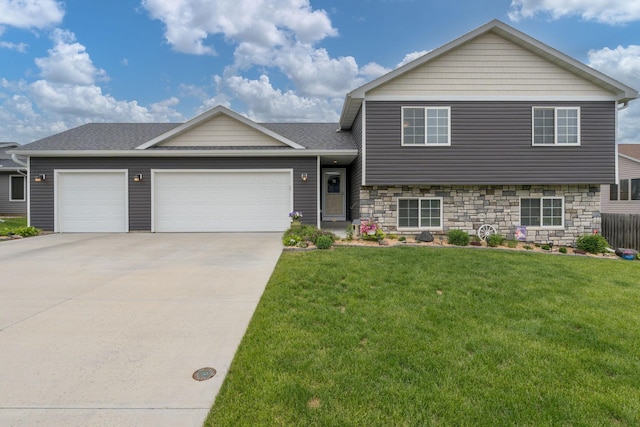 641 Beverly St, Wanamingo, MN 55983 - tri-level home featuring an attached garage, concrete driveway, a front lawn, and a shingled roof