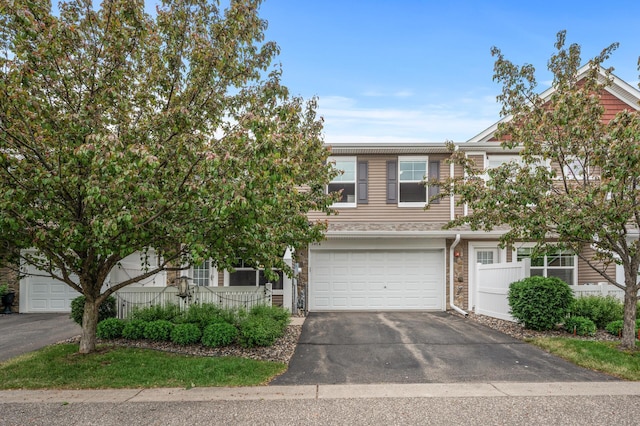 3474 White Pine Way, Stillwater, MN 55082 - view of front of home featuring driveway, an attached garage, and stone siding